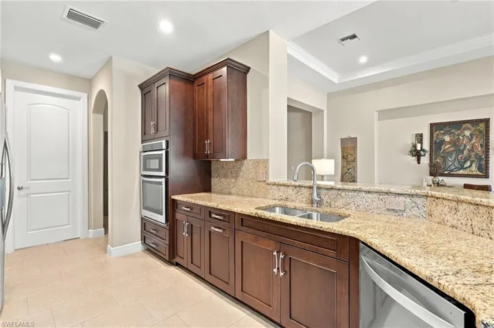 Prepare meals while staying connected to the conversation in the great room.