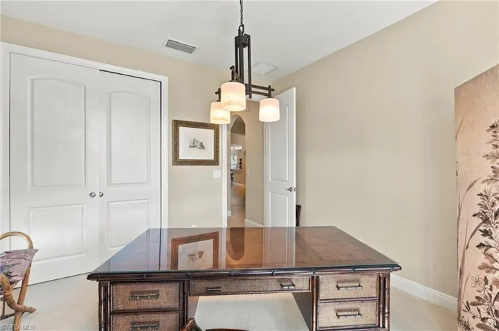 The guest bedroom is located on the opposite side of the home from the primary bedroom.