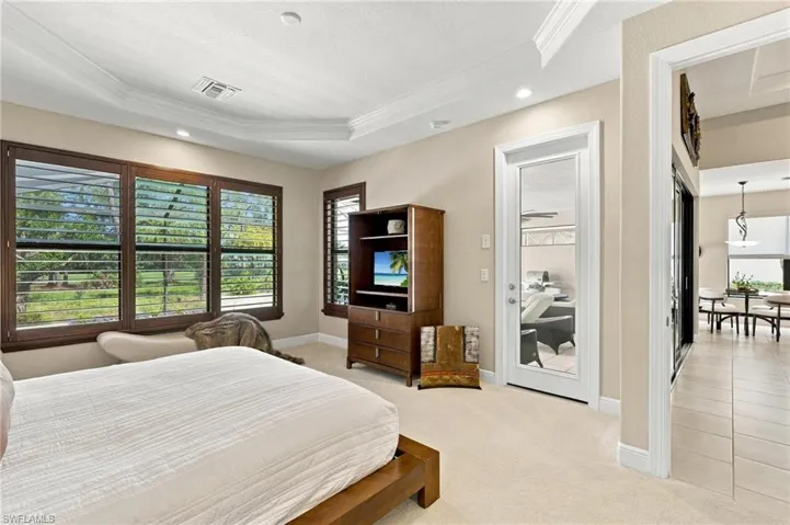 The primary suite also offers preserve and golf course views.