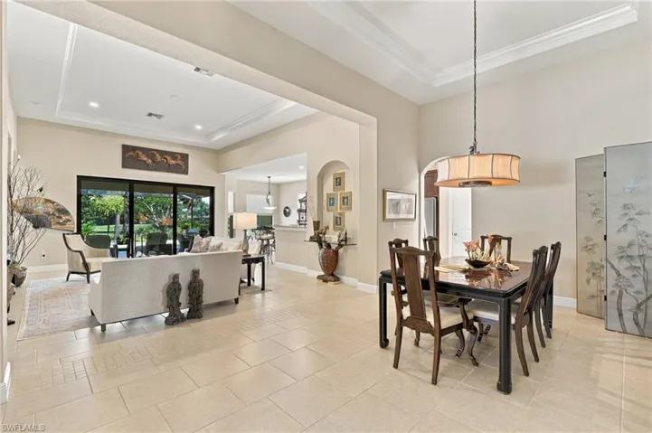 It’s all in the details—notice the beautiful flooring, tray ceilings, and arched wall niche.”