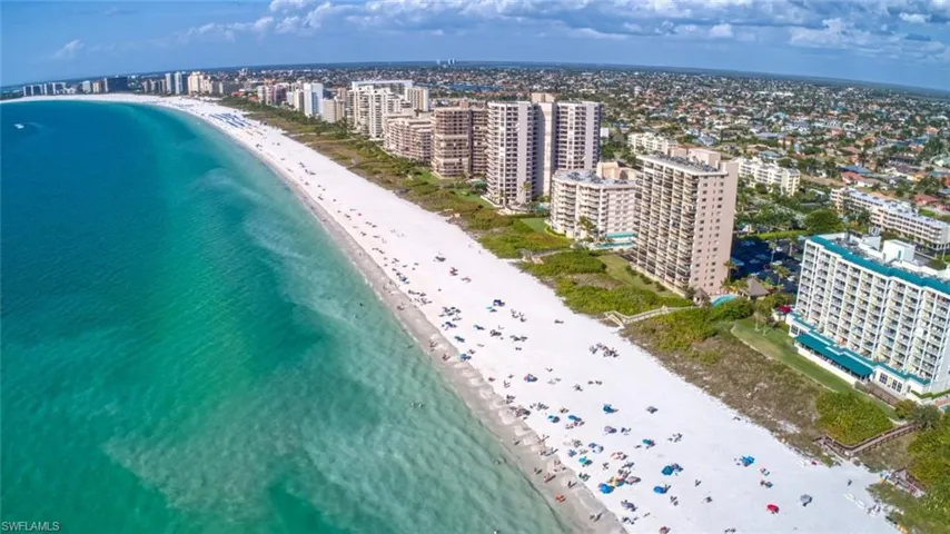 View of urban area featuring expansive beach