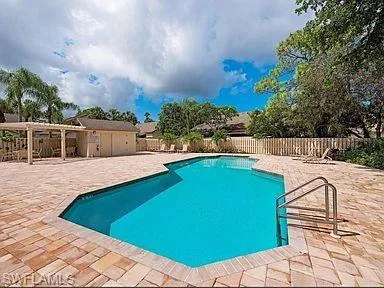 Community pool featuring a patio area