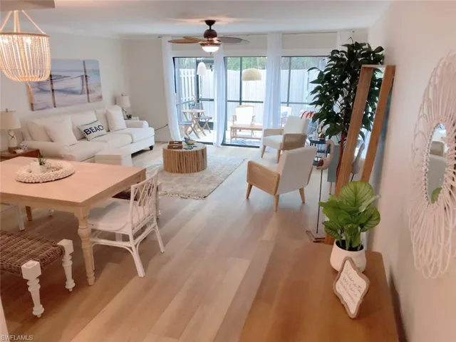 Living area featuring light wood finished floors and ceiling fan