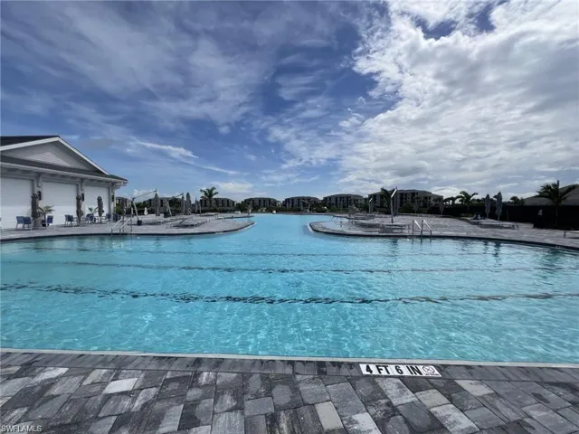 Community pool with a patio area