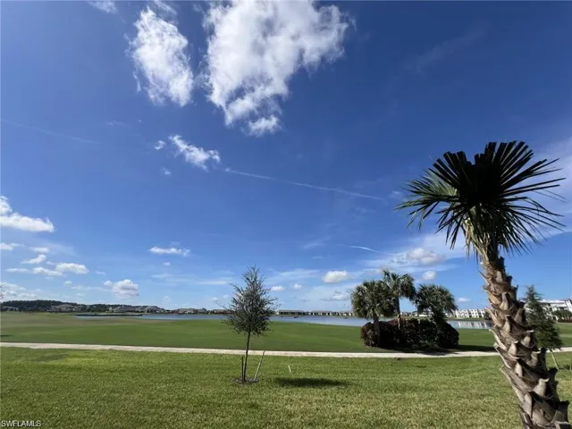 Backyard view of golf course and lake