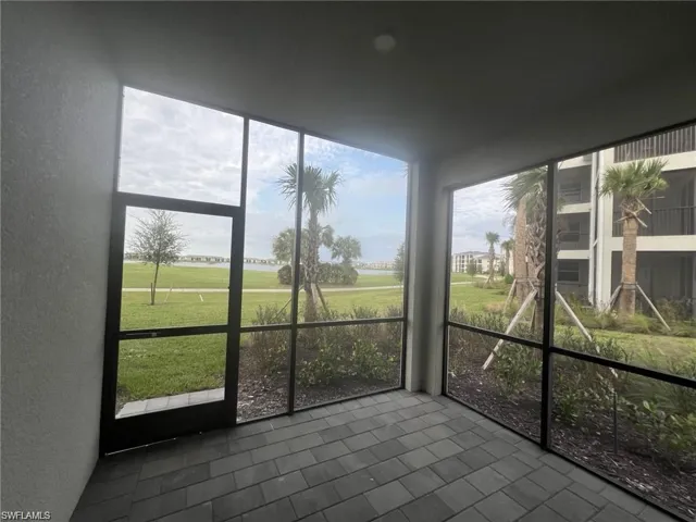 Unfurnished sunroom with golf course view