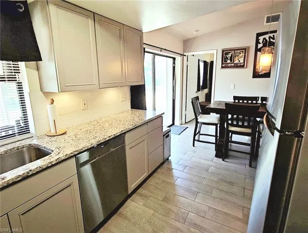 Kitchen with partial view to dining area