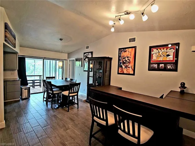 Back side of living room and view of dining area