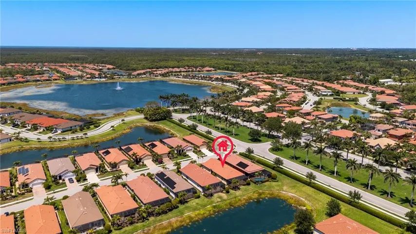 Aerial view featuring a residential view and a water view
