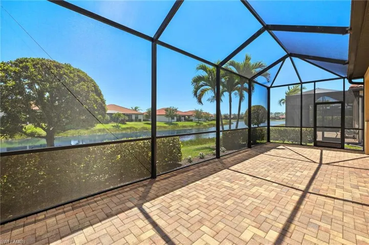 Unfurnished sunroom with a water view