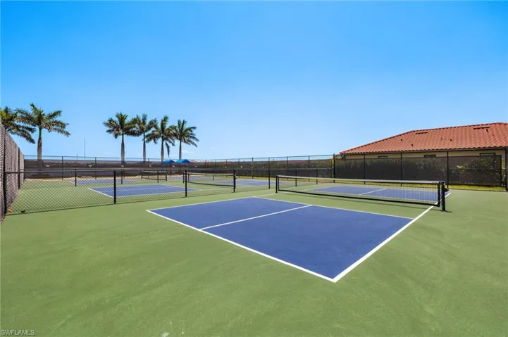 View of tennis court with fence