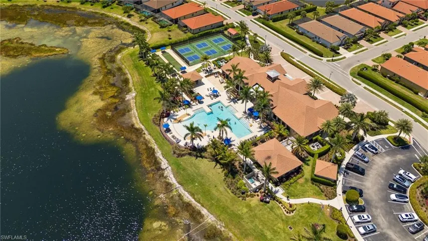 Drone / aerial view with a water view and a residential view
