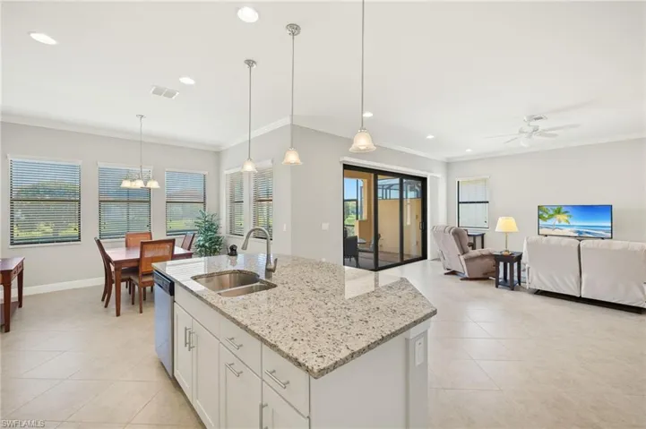 Kitchen with stainless steel dishwasher, visible vents, a sink, and light tile patterned floors