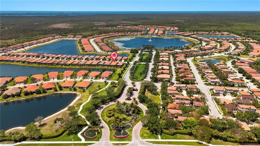 Birds eye view of property with a residential view and a water view