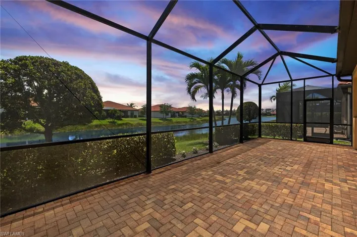 Unfurnished sunroom with a water view