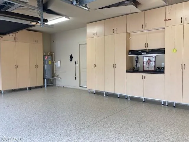 Garage featuring water heater