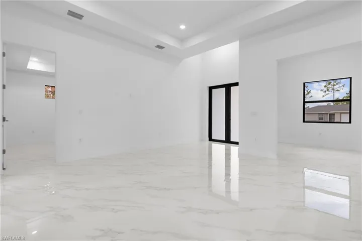 Living room featuring a tray ceiling