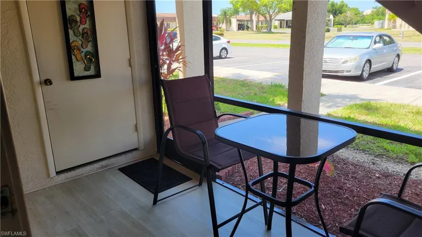 Screened patio, tile floor, parking space right outside the door