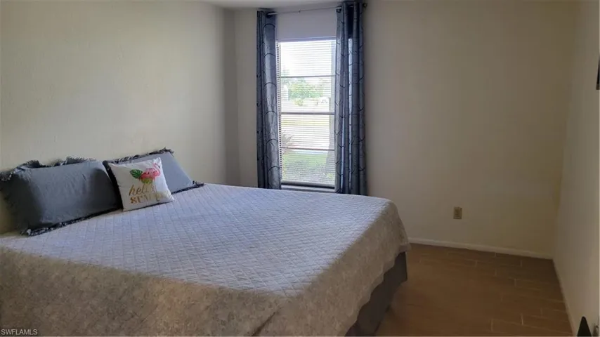 Bedroom featuring wood-look tile flooring