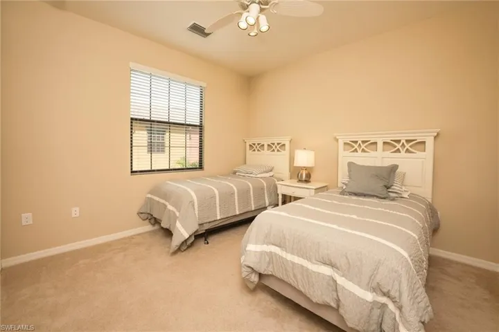 Bedroom with carpet flooring and ceiling fan