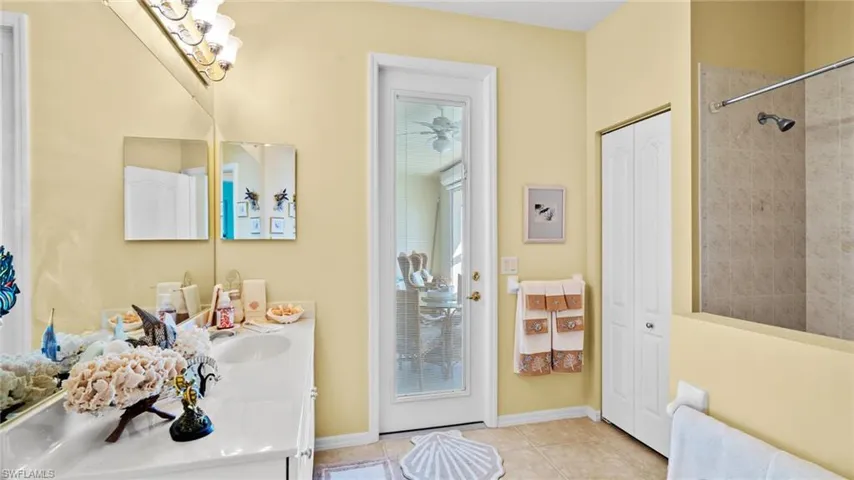 Bathroom featuring tile patterned flooring and vanity