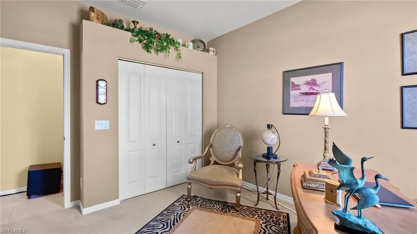 Living area with light carpet