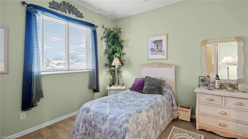 Bedroom with wood-type flooring