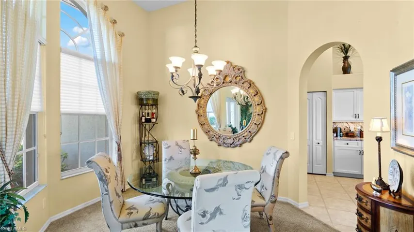 Dining area featuring a chandelier and light tile patterned floors