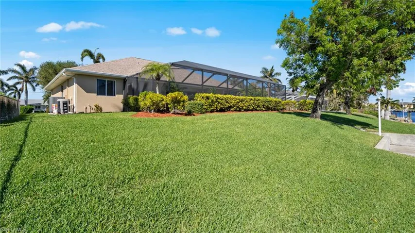 View of yard with a lanai