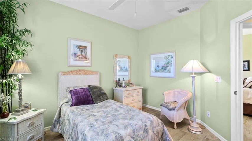 Bedroom featuring light wood-type flooring and ceiling fan