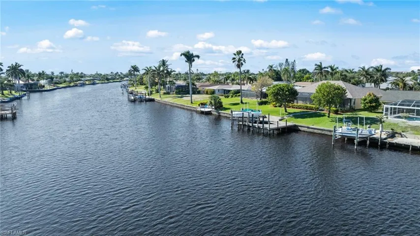 Property view of water featuring a dock