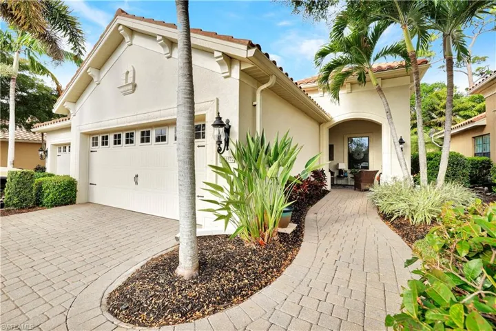 Mediterranean / spanish-style house featuring stucco siding, decorative driveway, a garage, and a tiled roof