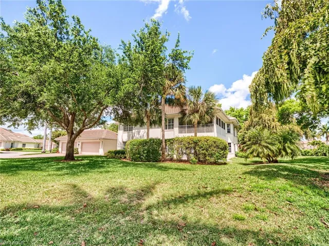 Spacious corner condo with large landscaped area for privacy