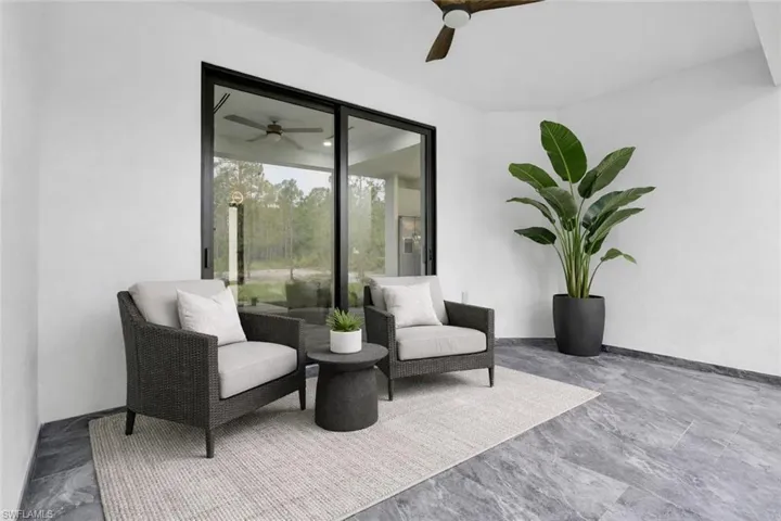 View of patio featuring ceiling fan