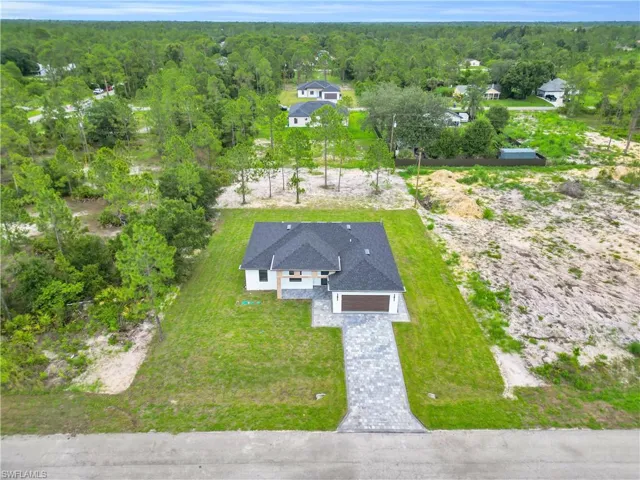 View from above of property featuring a forest