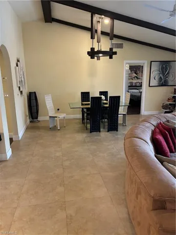 Vaulted ceilings with exposed dark wood beams
