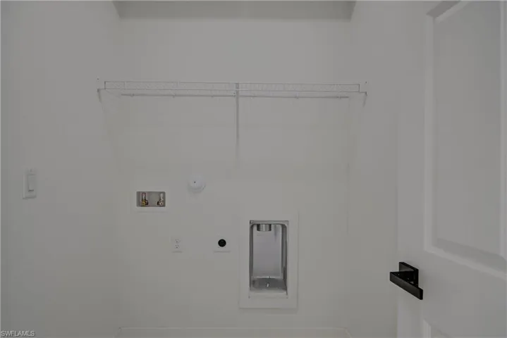 Washroom with electric dryer hookup, washer hookup, and gas dryer hookup
