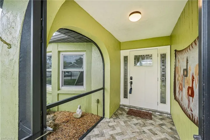 Property entrance with stucco siding