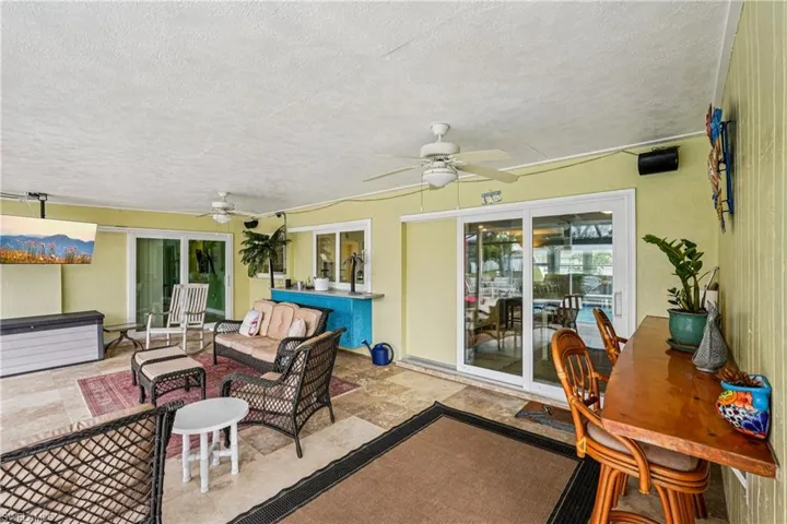 View of patio featuring outdoor seating and a ceiling fan
