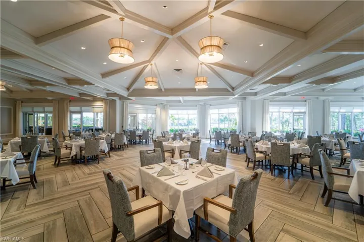 Dining area with crown molding, coffered ceiling, and recessed lighting