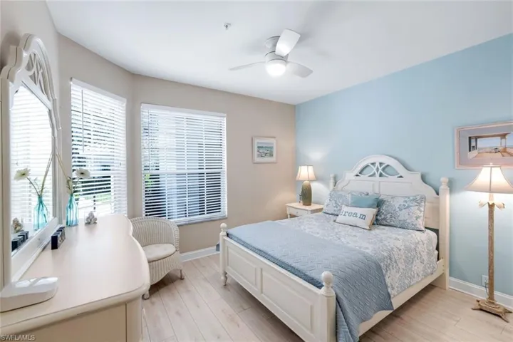 Bedroom with light wood-style floors and ceiling fan
