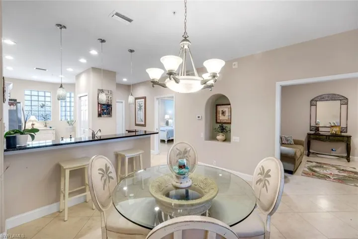 Dining space featuring a chandelier and light tile patterned floors