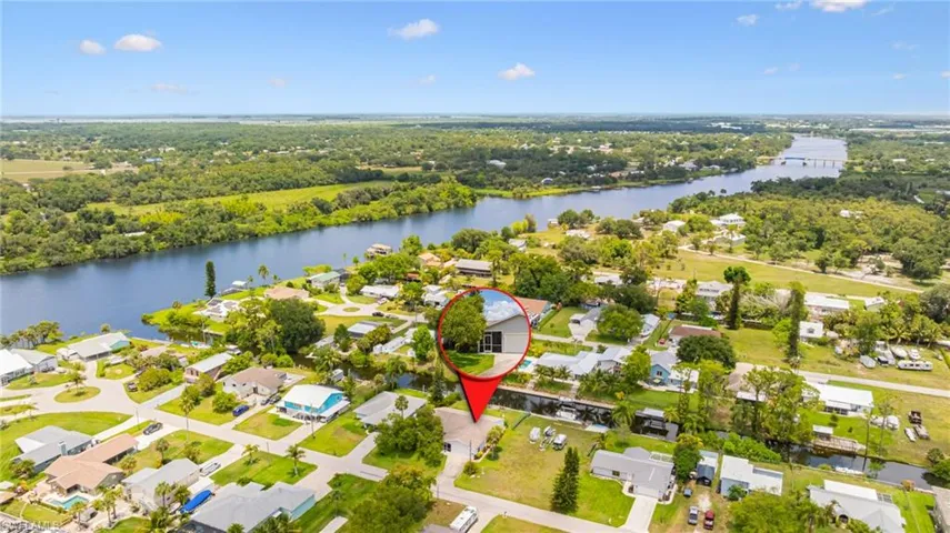 Aerial perspective of suburban area with a nearby body of water