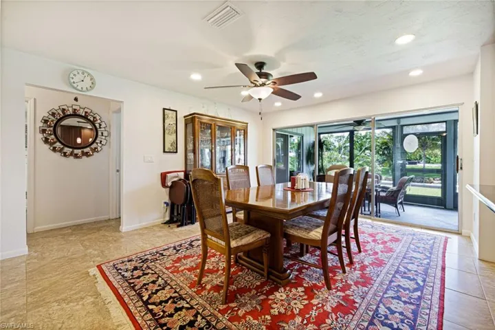 Dining room with a ceiling fan, recessed lighting, baseboards, and light tile patterned flooring