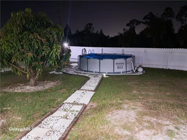 View of yard featuring a fenced in pool