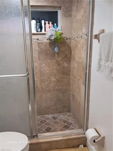Bathroom featuring toilet and walk in shower