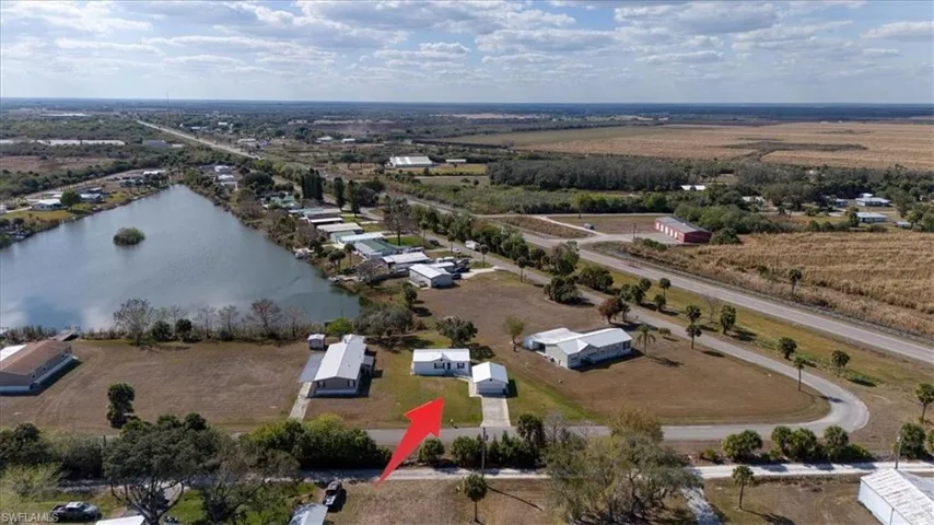 Aerial view of sparsely populated area with a nearby body of water
