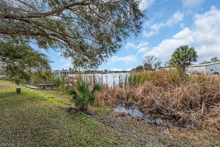 View of yard with a water view