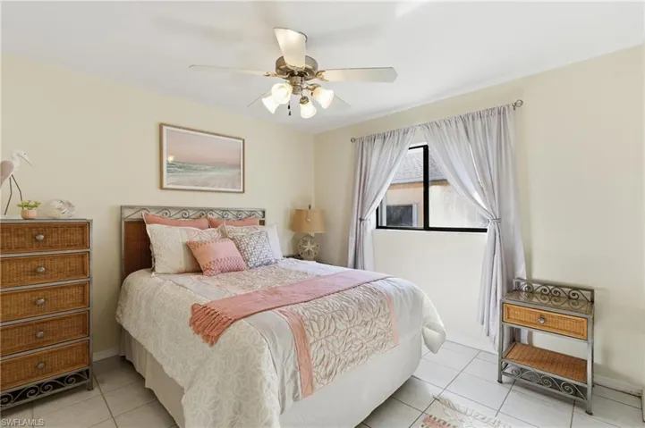 Bedroom featuring ceiling fan and light tile patterned flooring