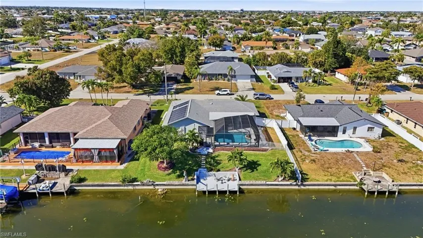 Aerial overview of property's location featuring nearby suburban area and a nearby body of water